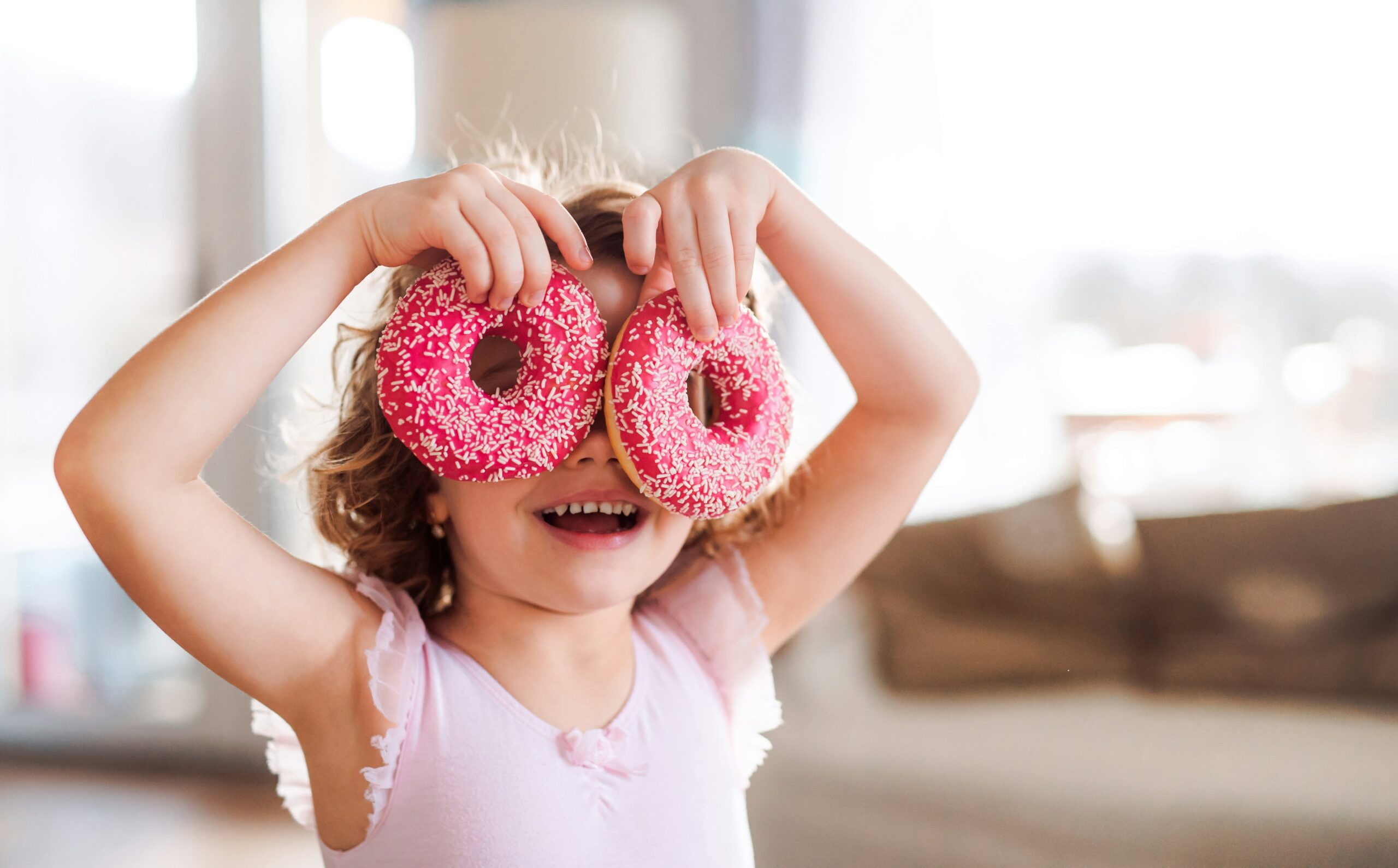 Happy-girl-with-doughnuts