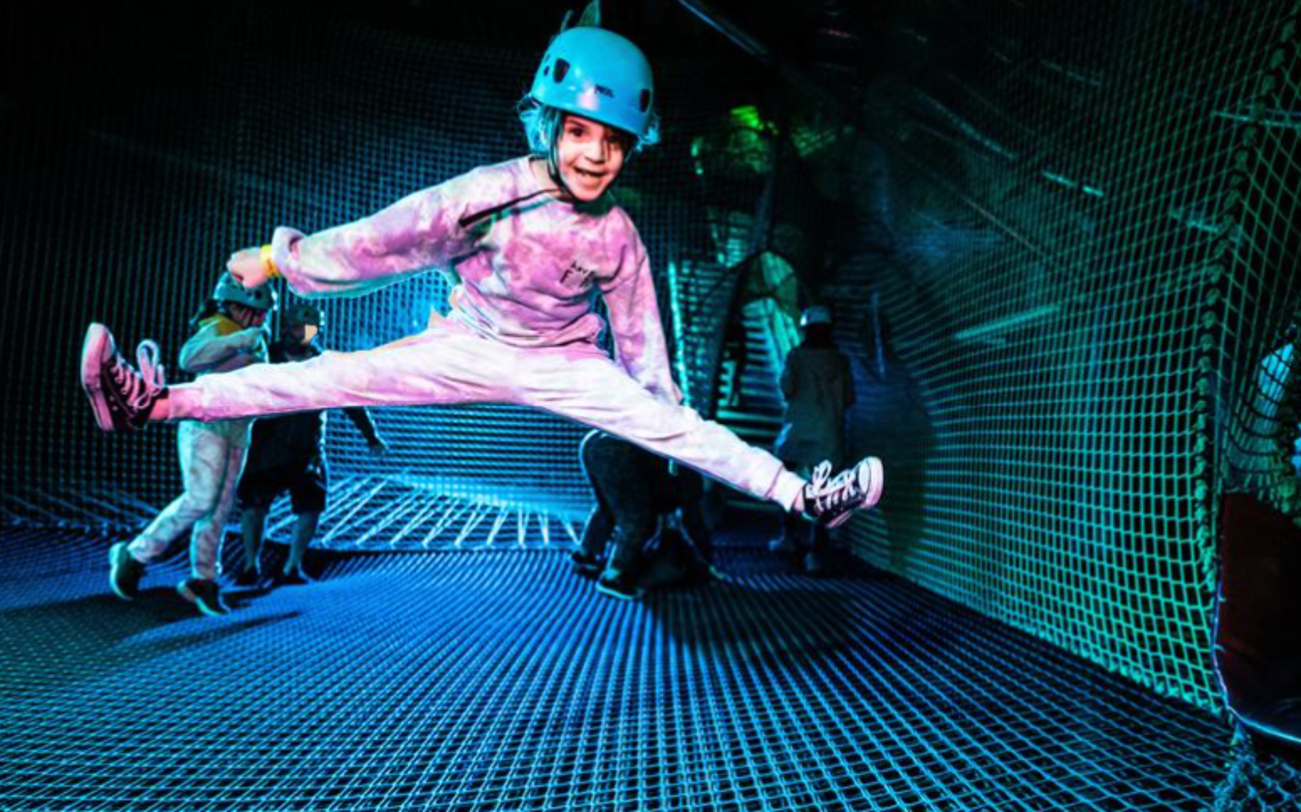 Bounce Below girl jumping in underground cave mine trampoline