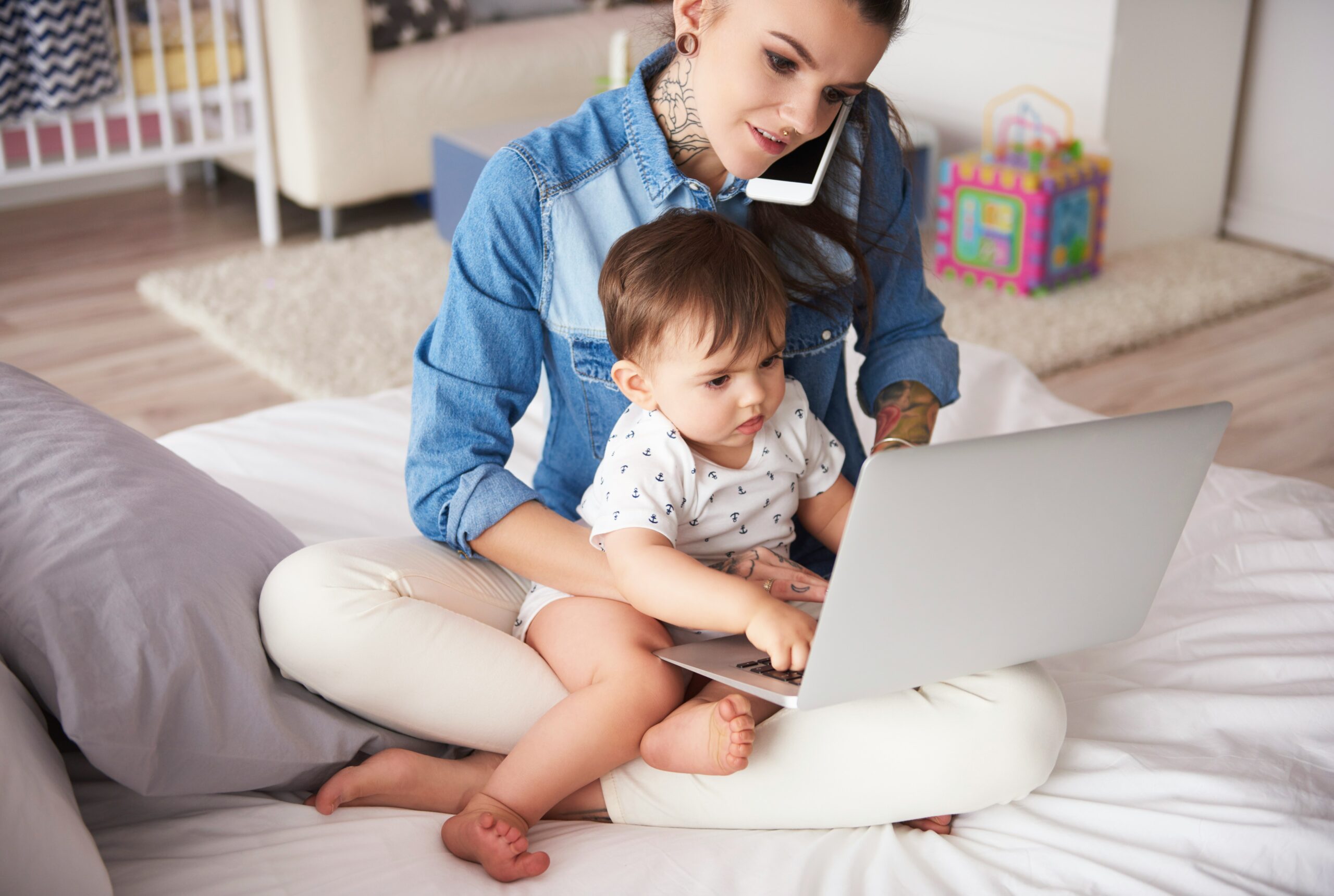 Mother working from home with toddler