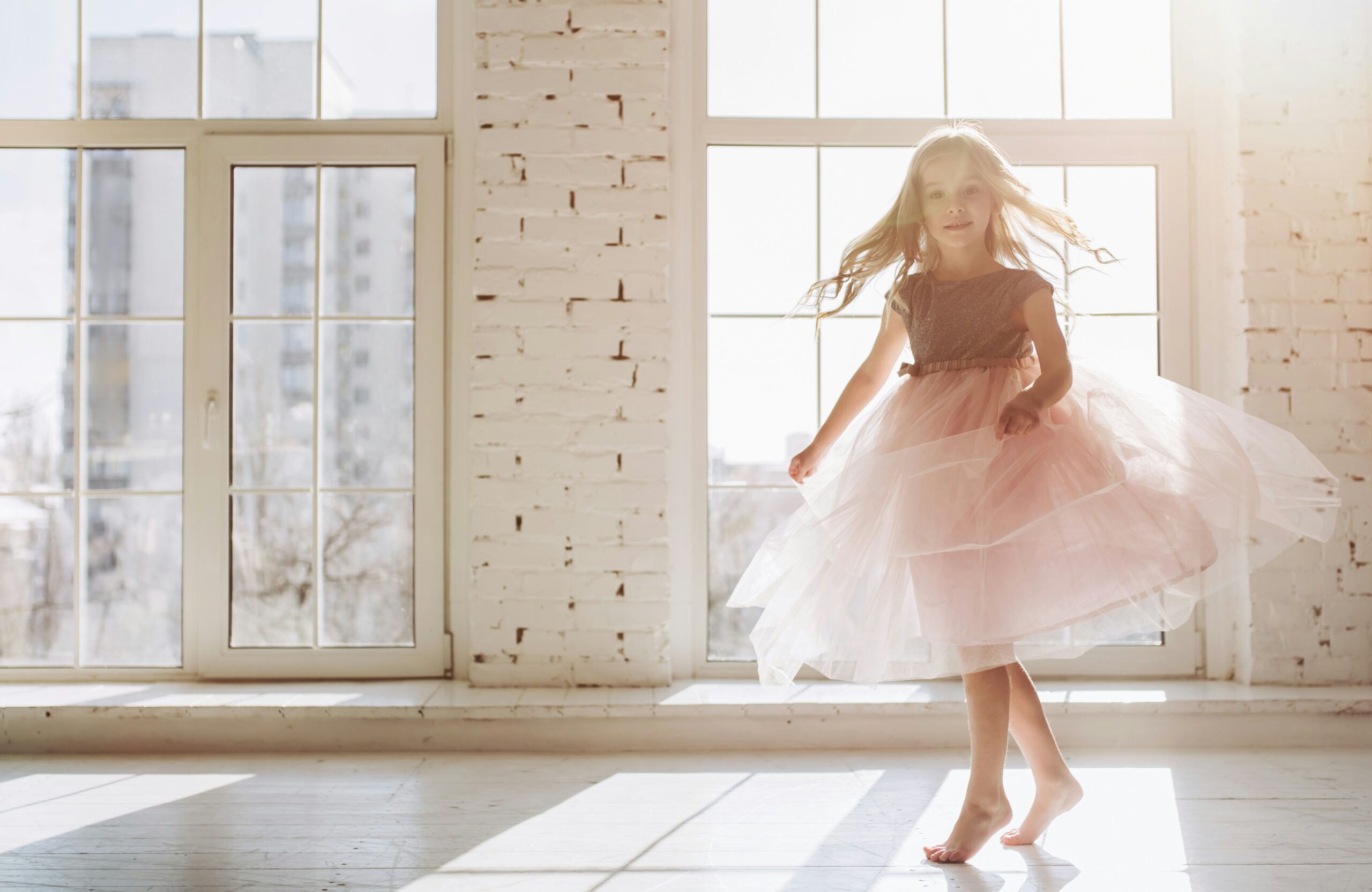 Girl Twirling in a Princess Dress